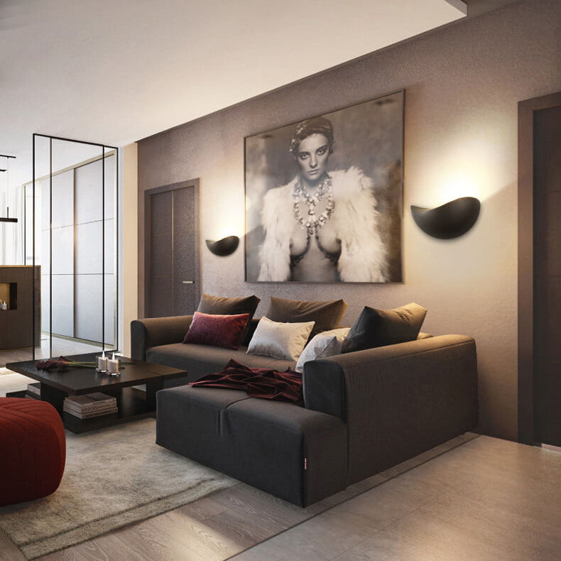 Modern living room with a gray sofa, coffee table, and wall art.