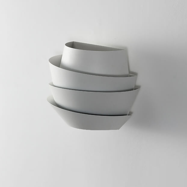 Set of three gray bowls stacked on a light gray background