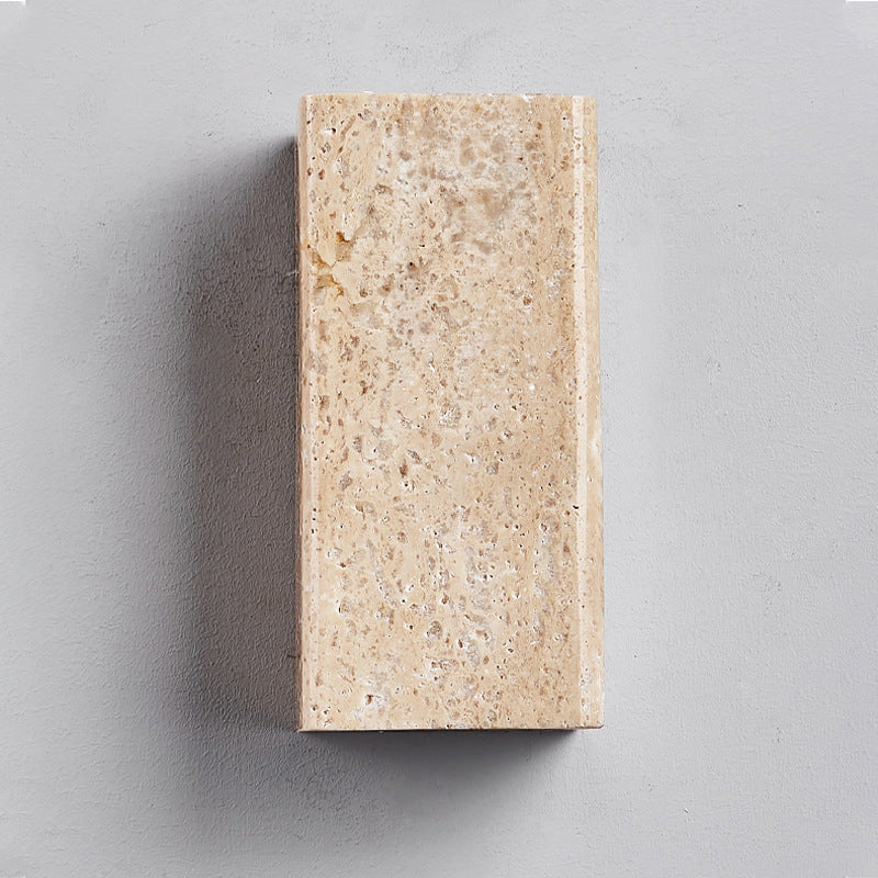 Beige stone block on a gray background