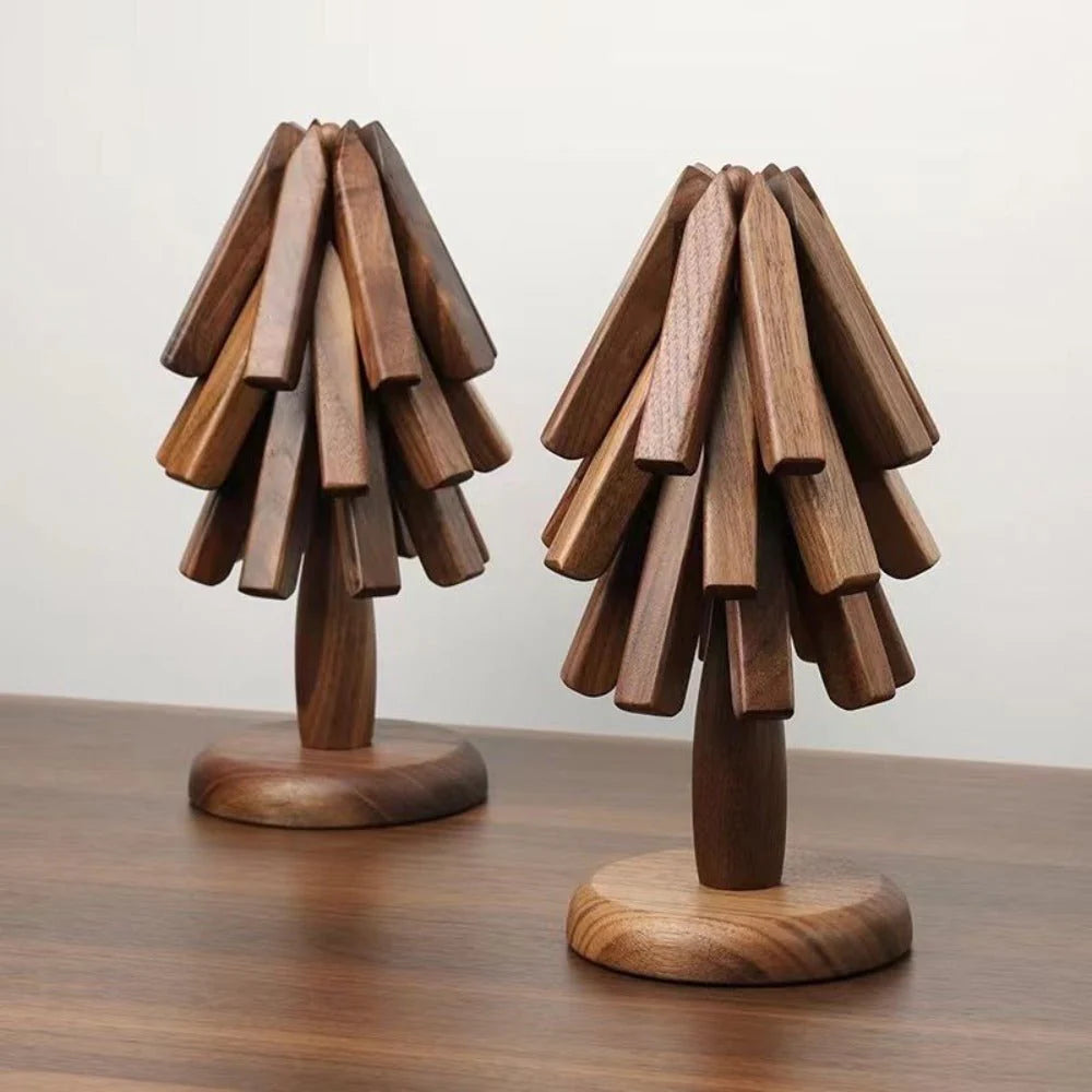 Two wooden lampshades on a wooden base against a plain background