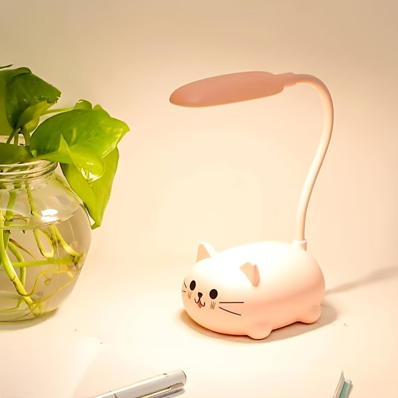 Cat-shaped desk lamp with a flexible neck next to a plant on a light background