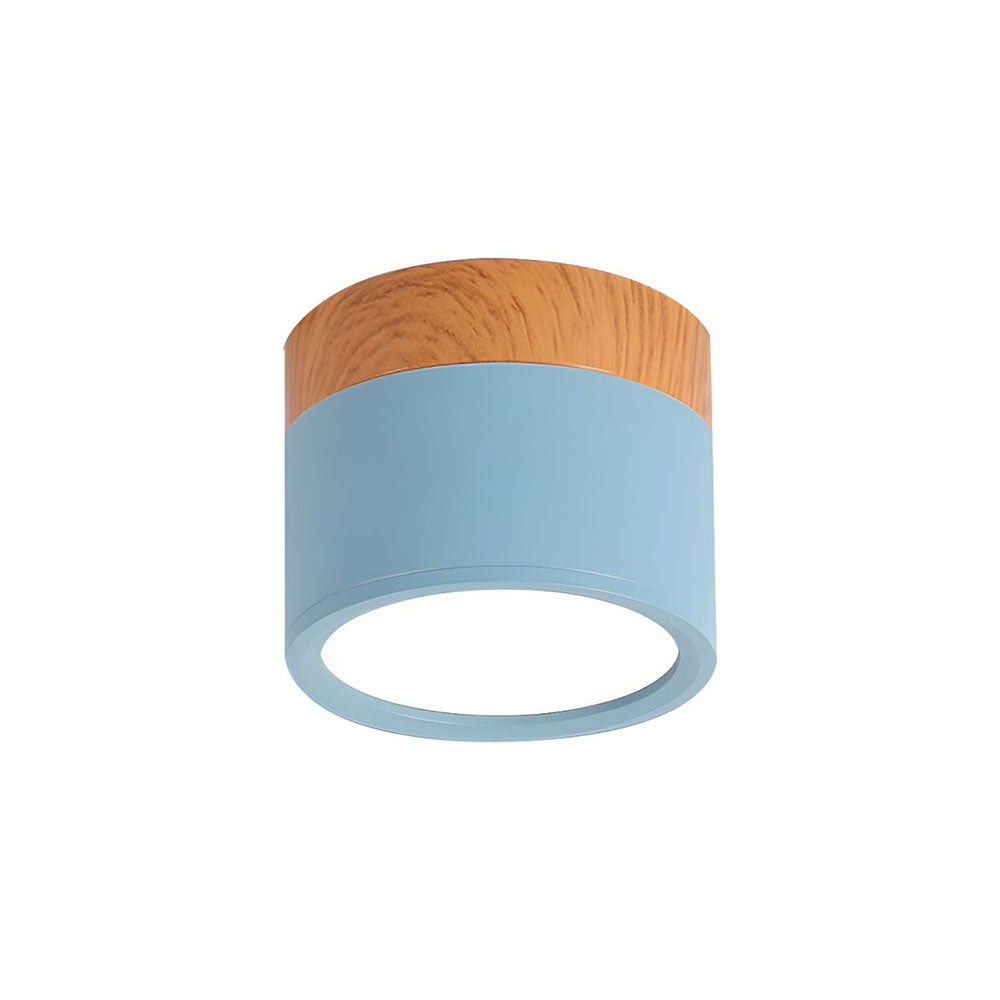 Ceiling light fixture with wooden top and blue base on a white background