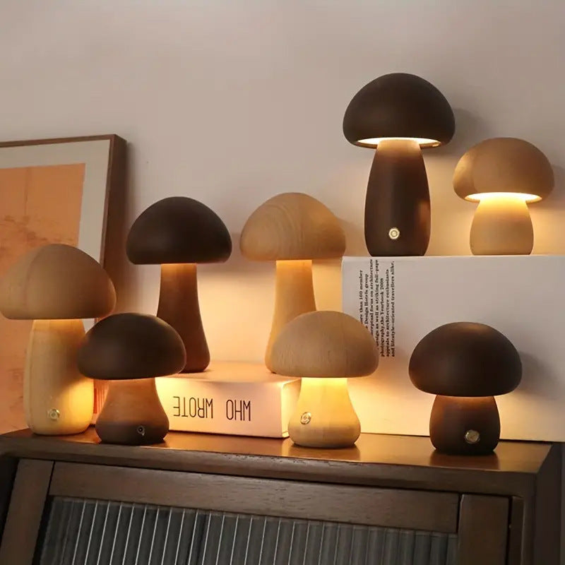 Set of mushroom-shaped lamps on a wooden surface with a neutral background
