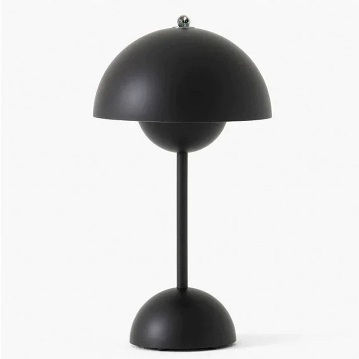 Black table lamp with a unique design on a white background