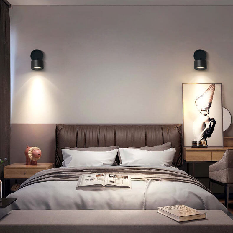 Modern bedroom with a bed, nightstands, and wall art.