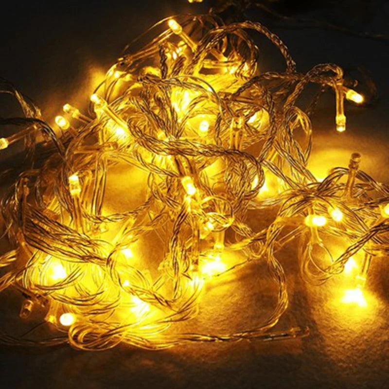 String of lights with warm yellow glow on a dark background