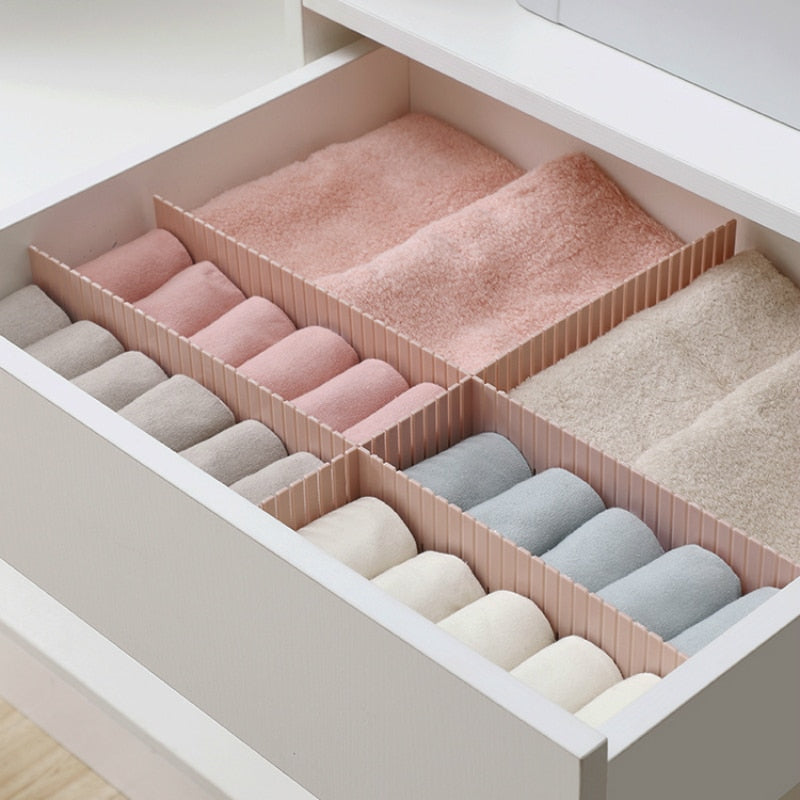 Organized drawer with pink and gray sock organizer