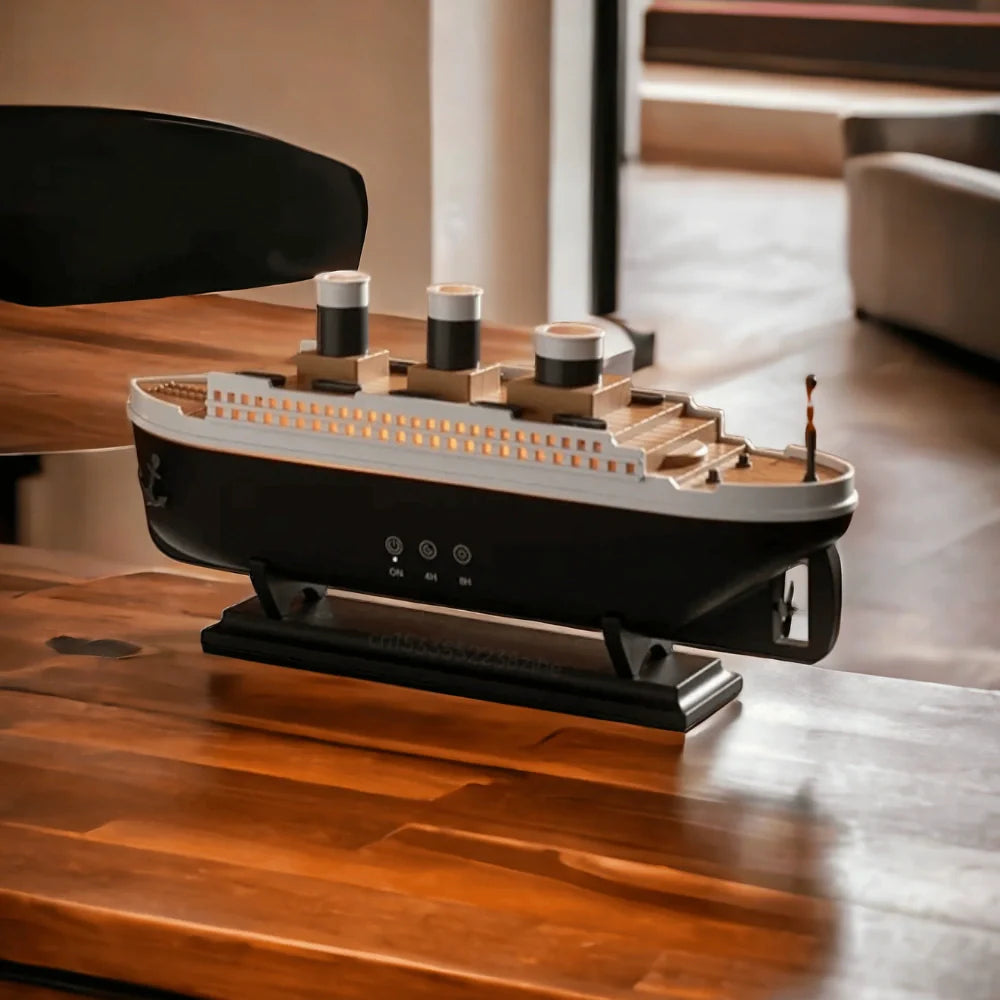 Model of a ship on a wooden table with a blurred background