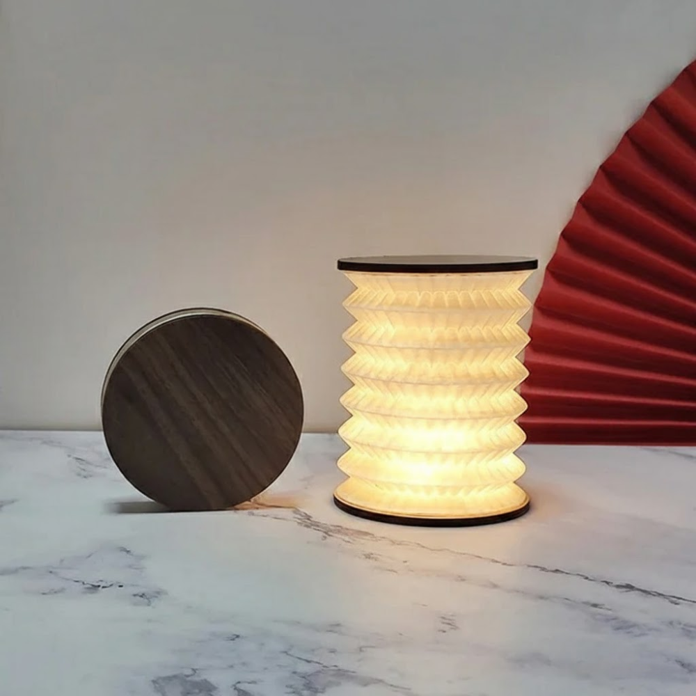 Modern lamp with wooden base on a marble surface