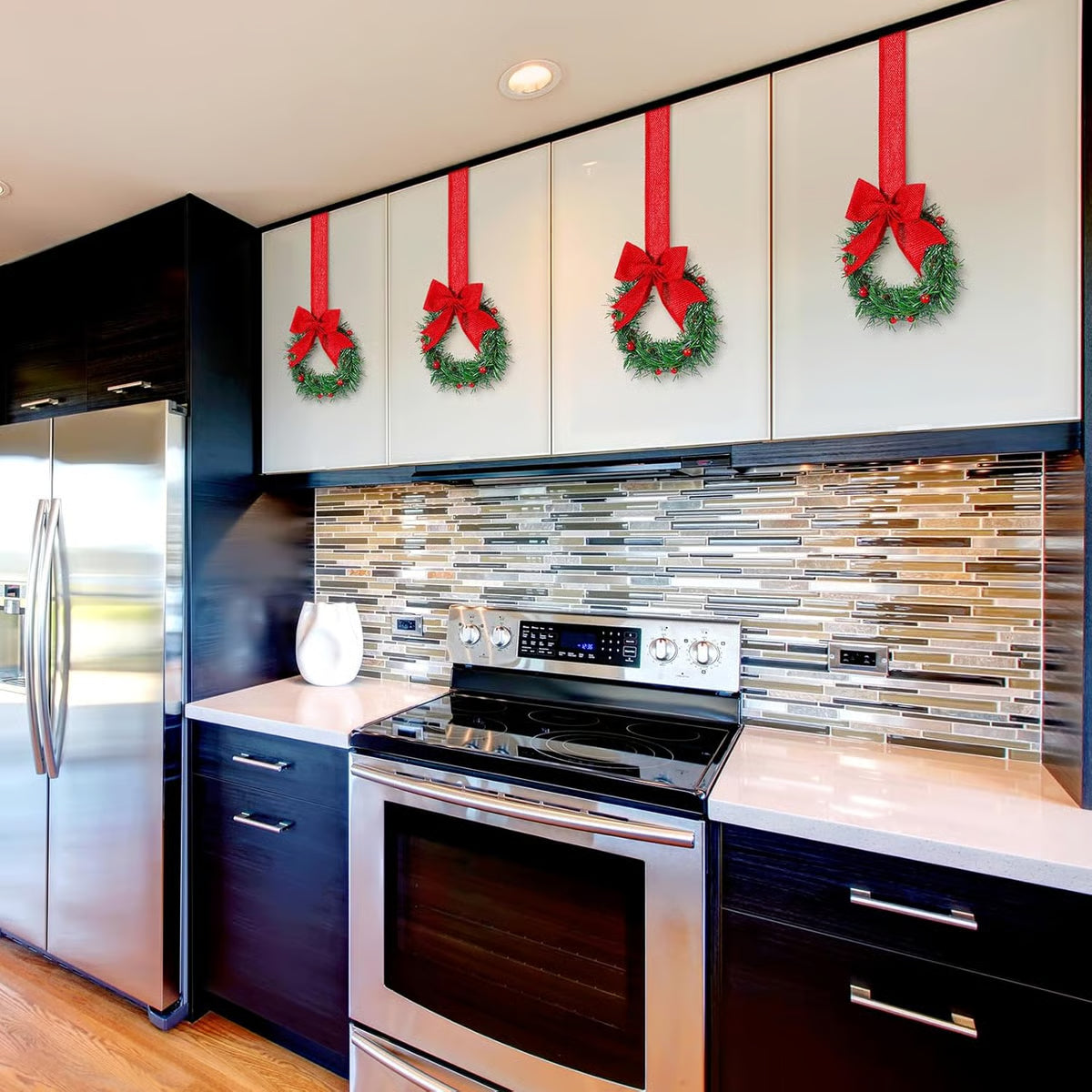 Modern kitchen with festive wreath decorations on cabinets