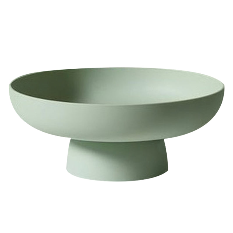 Green ceramic bowl on a white background