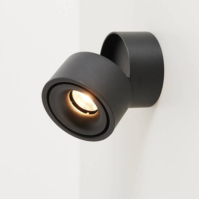 Modern black wall-mounted light fixture on a white background