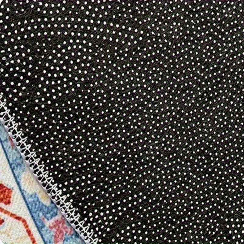 Black fabric with white polka dots on a textured surface