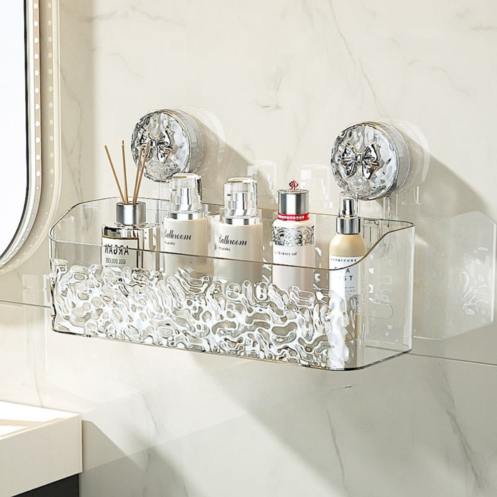 Clear decorative shelf with various bottles on a white surface