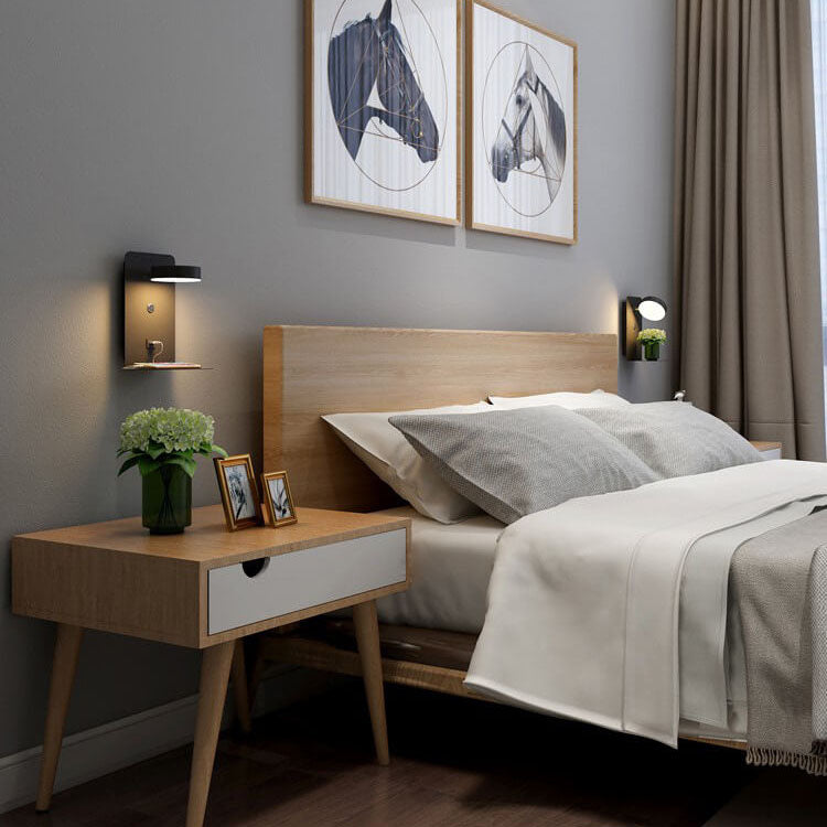 Modern bedroom with wooden bed and side table, featuring horse art on the wall.