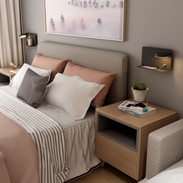 Modern bedroom with a bed, nightstand, and wall art