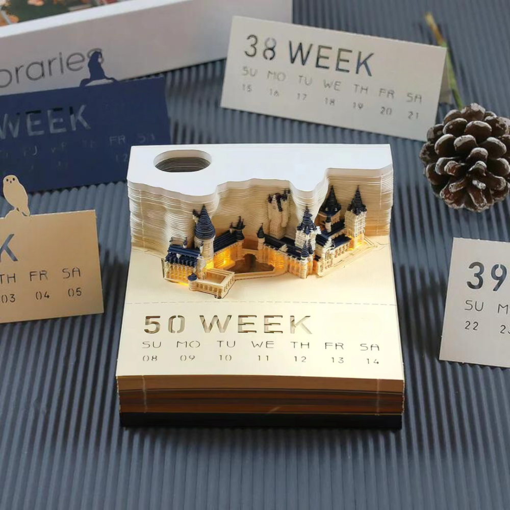 3D castle model calendar on a textured surface with decorative elements.
