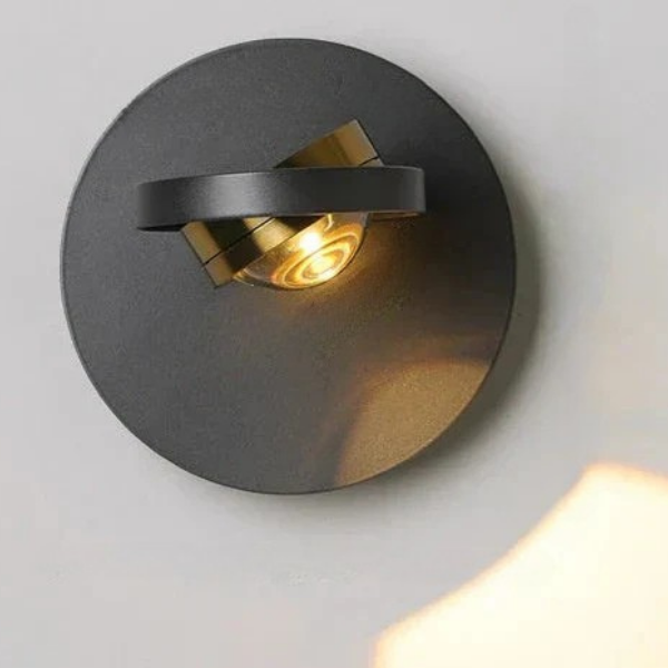 Modern wall-mounted light fixture on a gray wall
