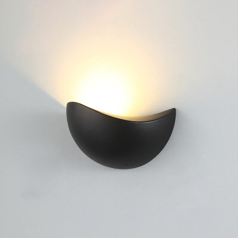 Modern wall-mounted light fixture on a plain background