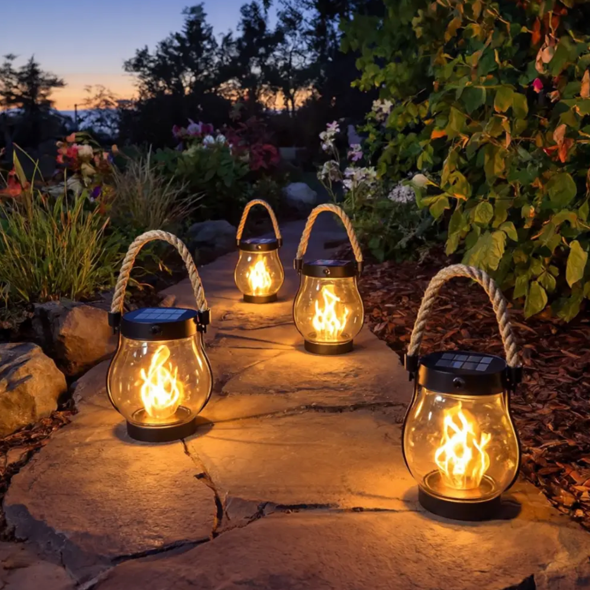 Solar-powered lanterns on a stone pathway with a garden background