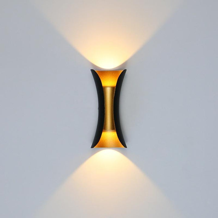 Modern wall-mounted light fixture on a plain background