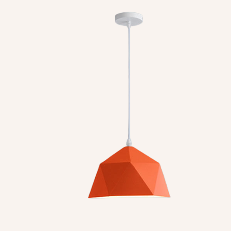Orange pendant light with white cord on a white background