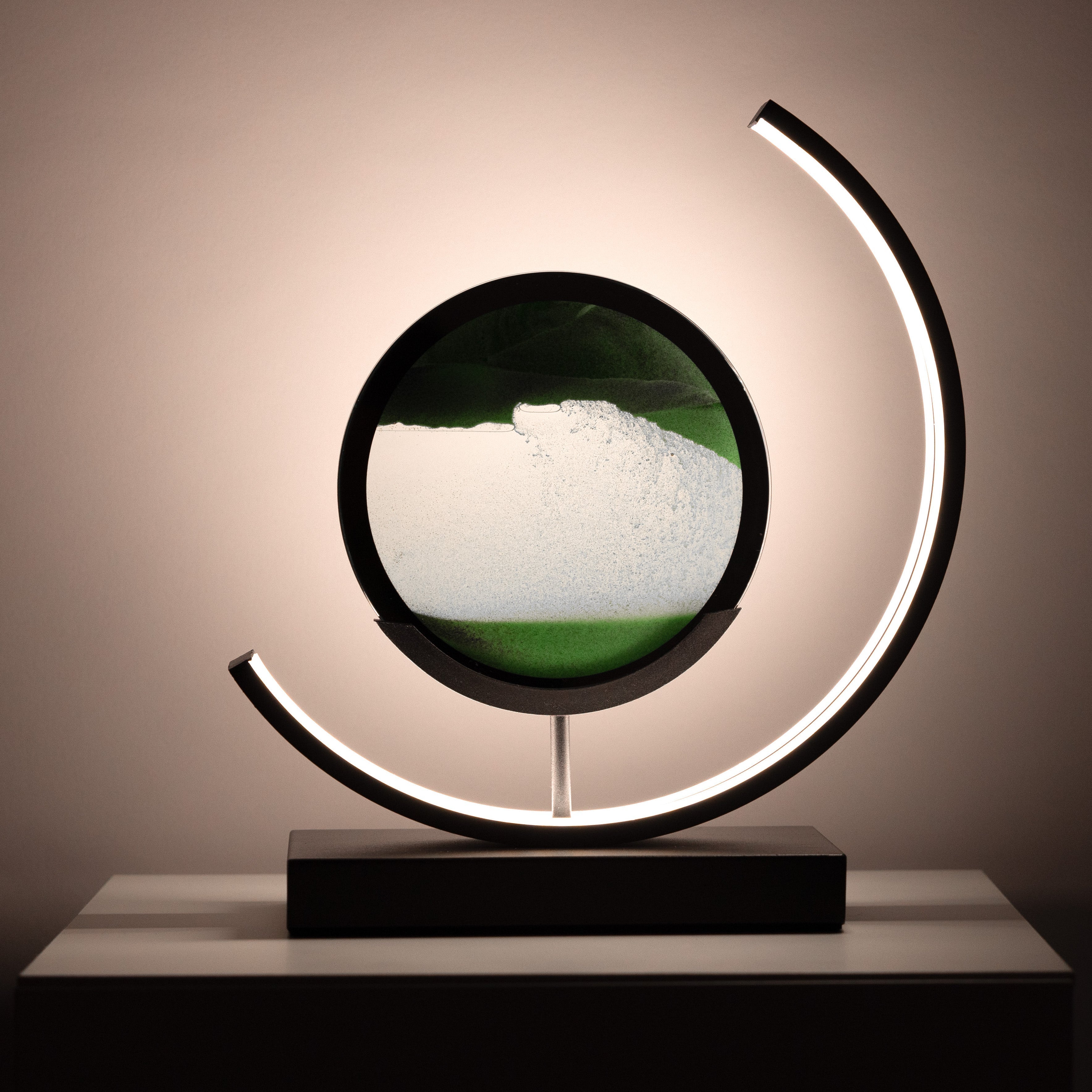 Decorative lamp with a circular design and LED lighting on a neutral background