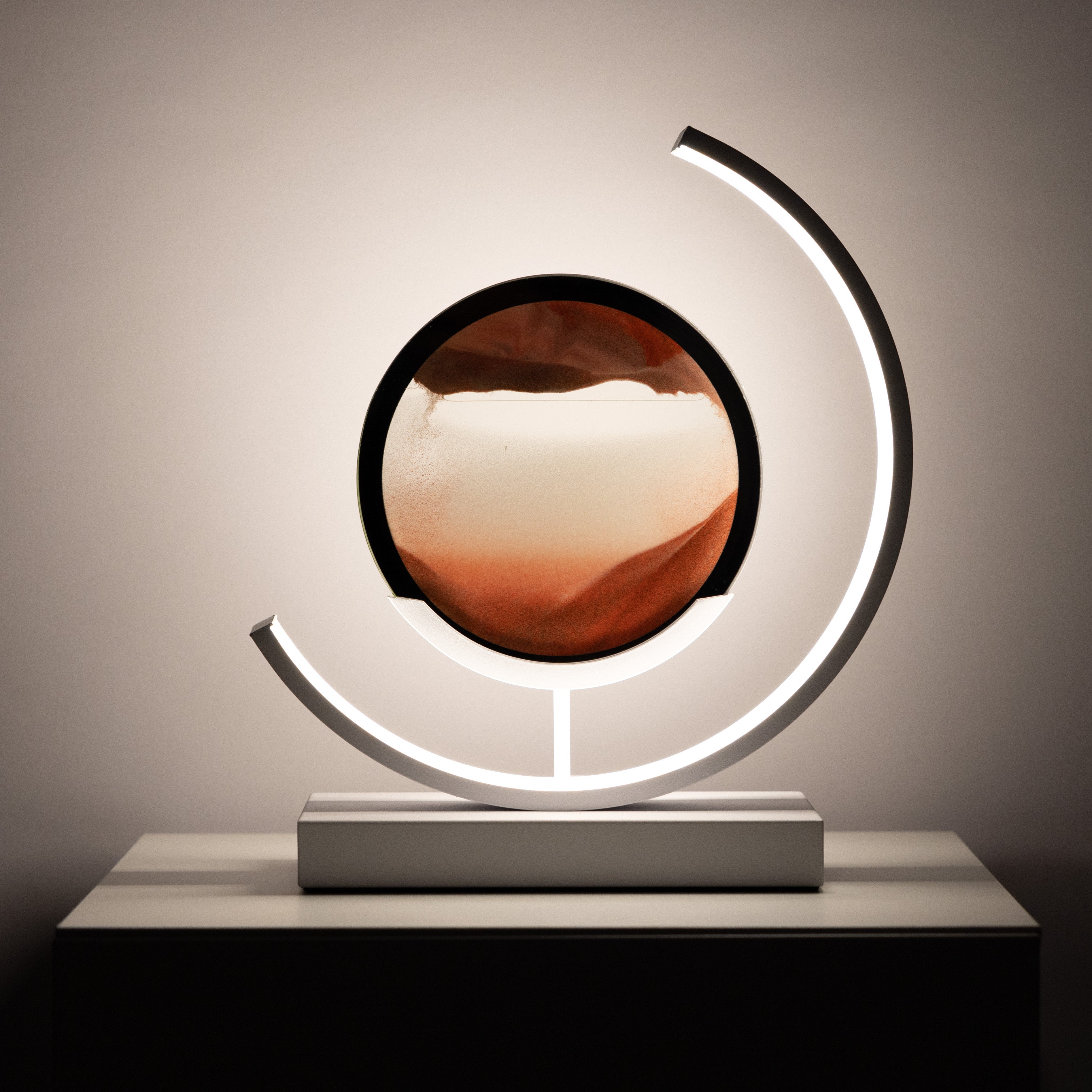 Modern decorative lamp with a circular design on a neutral background