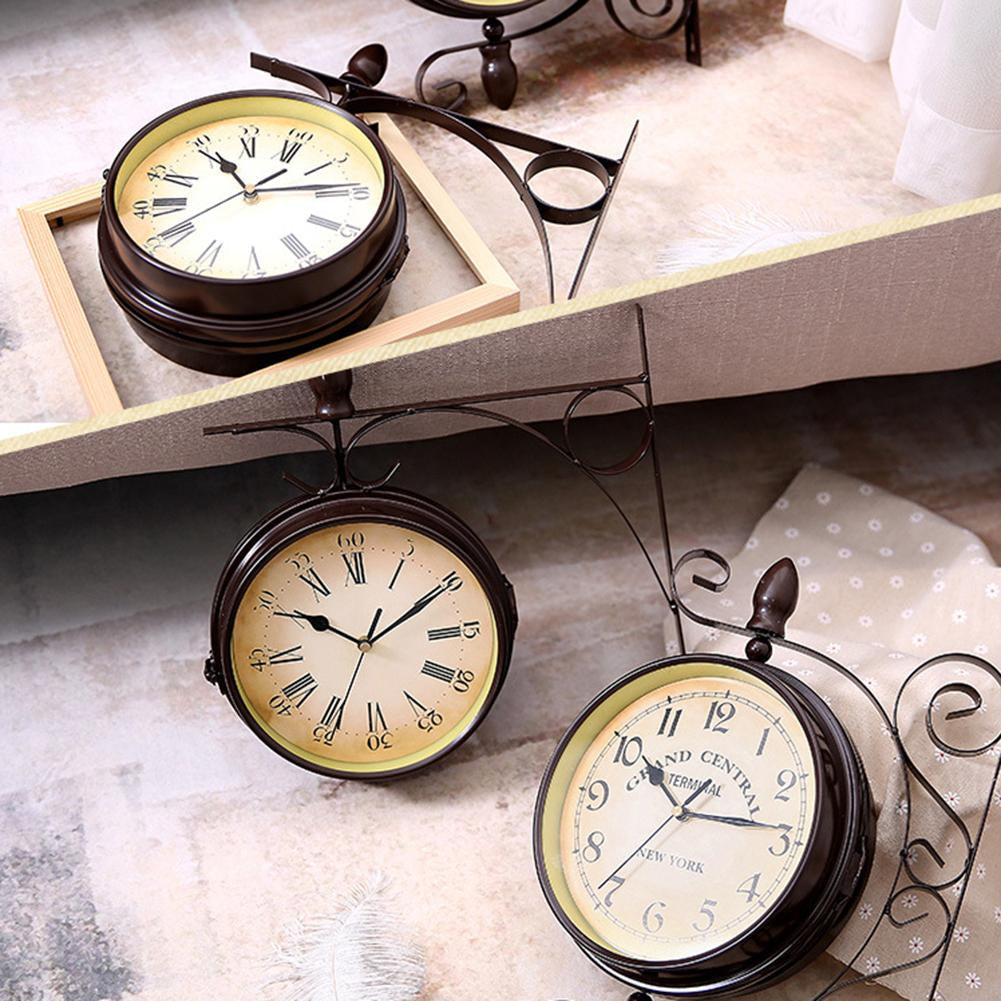 Set of three vintage-style wall clocks on a surface with a neutral background