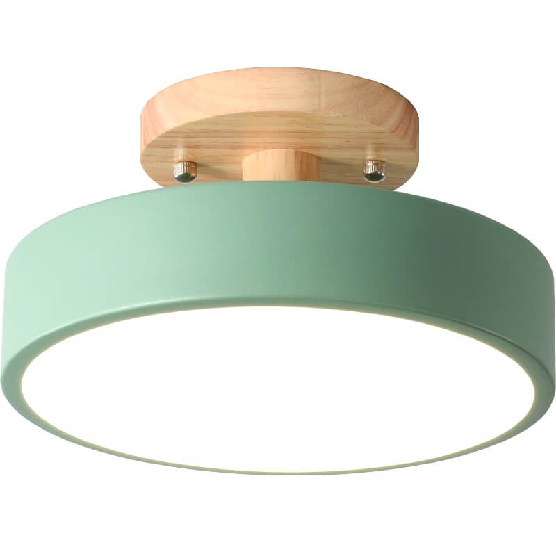 Ceiling light fixture with green shade and wooden finish on a white background