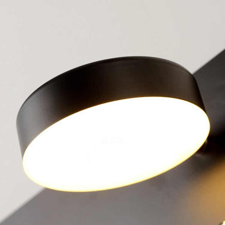 Modern ceiling light fixture with black finish and white interior on a neutral background