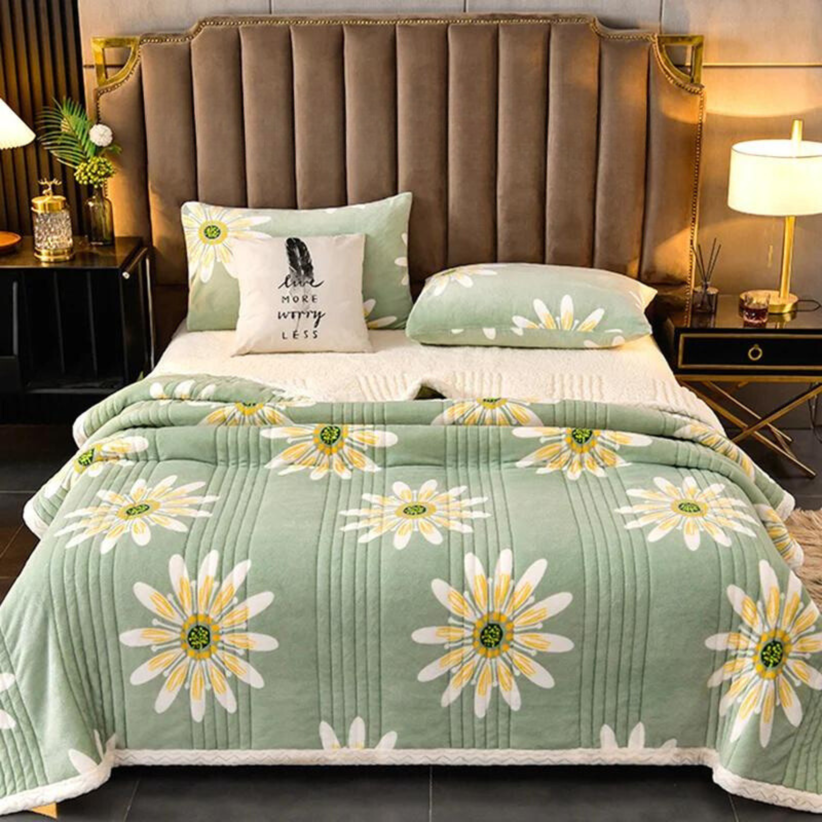 Bed with green floral comforter and decorative pillows in a bedroom setting.