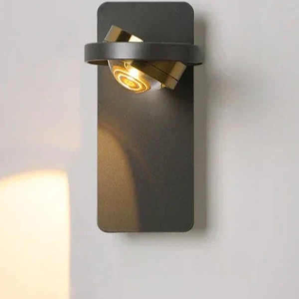 Modern wall-mounted light fixture on a plain wall