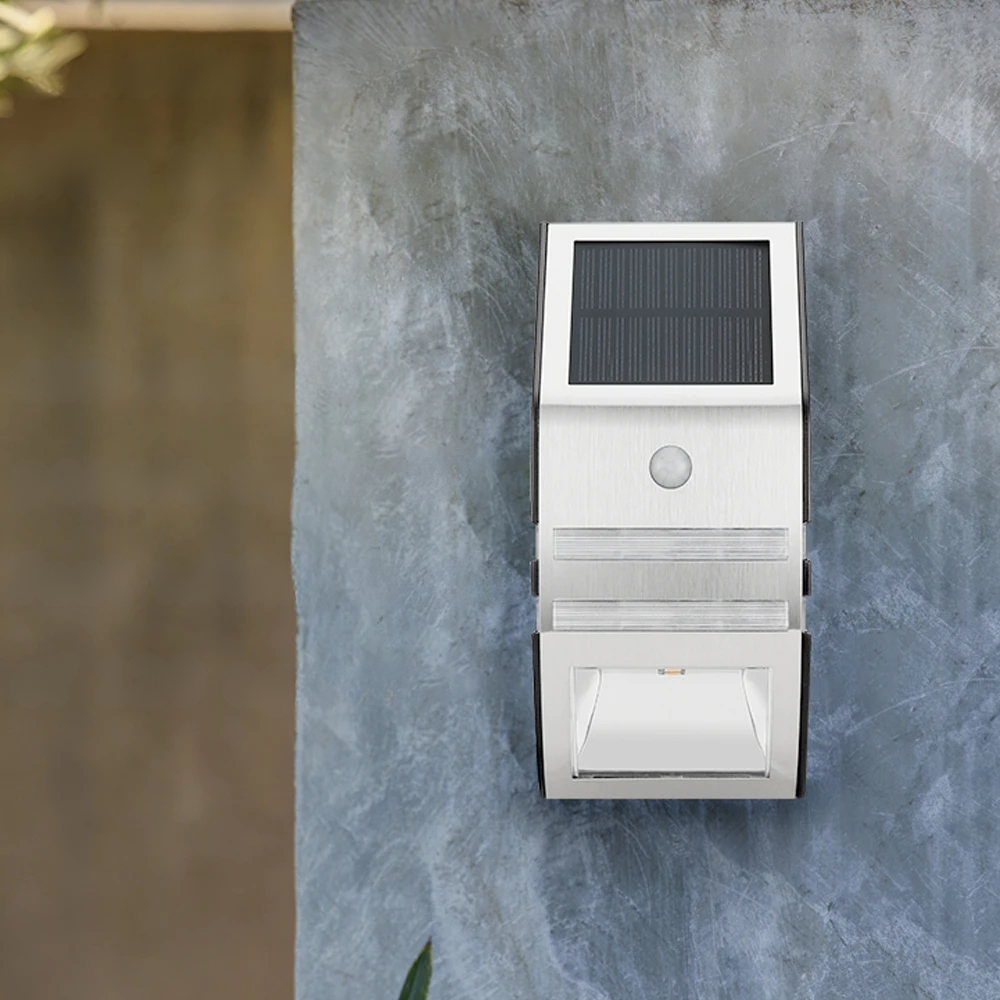 Solar-powered outdoor wall light fixture on a textured stone wall.
