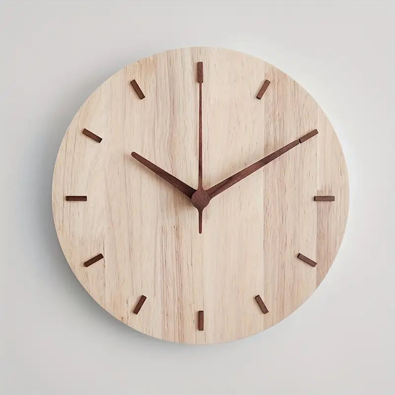 Wooden wall clock with brown hands on a light gray background