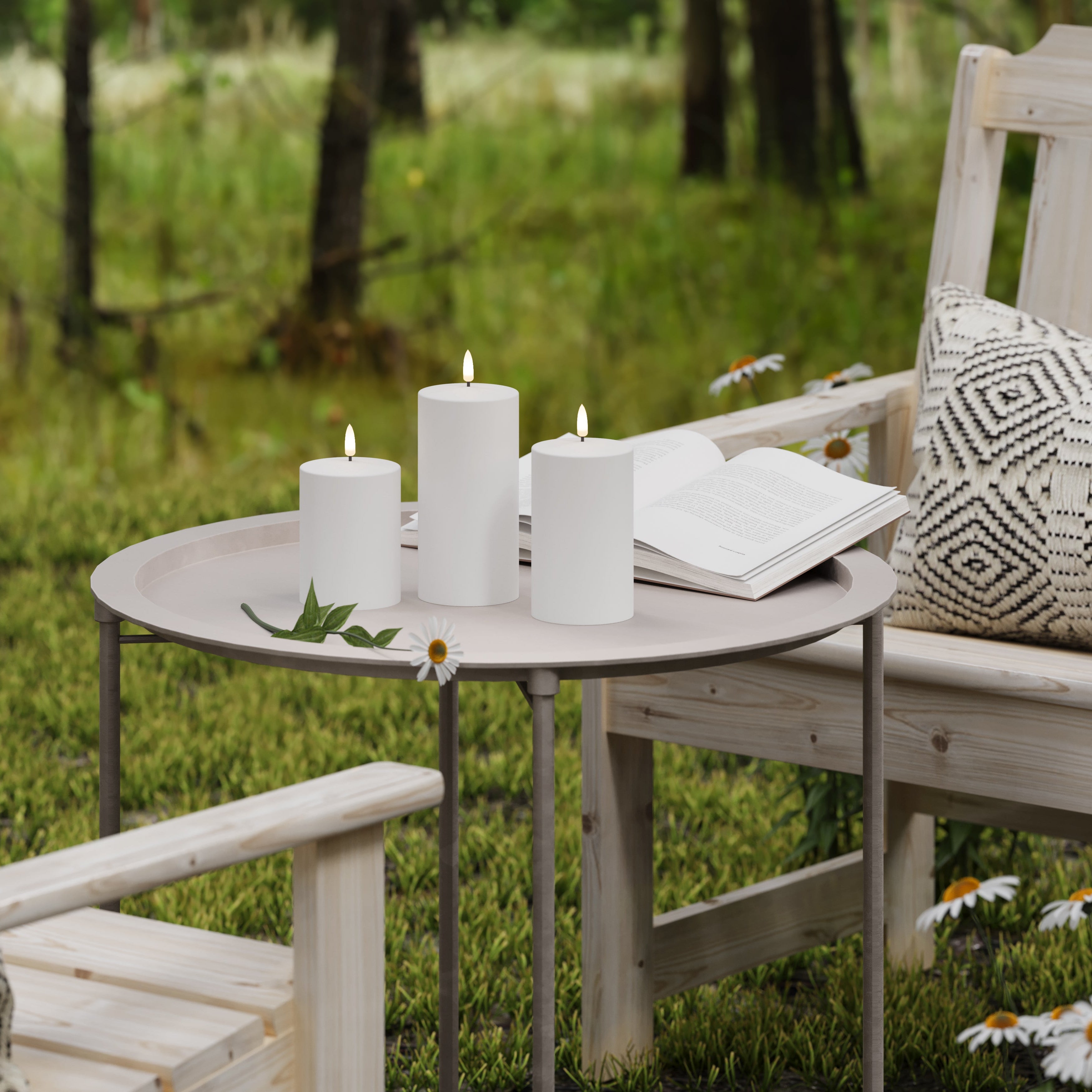 Outdoor setting with wooden furniture, candles, and a book on a small table.