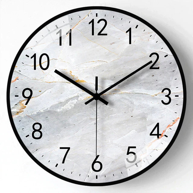 Round wall clock with marble design on a white background