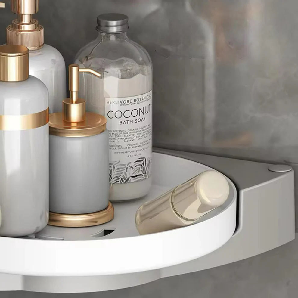 Bathroom shelf with soap dispensers and a bottle of coconut bath soap.