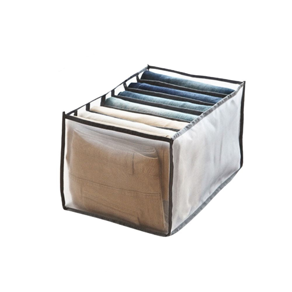 Clear storage cube with dimensions labeled, containing folded clothes.
