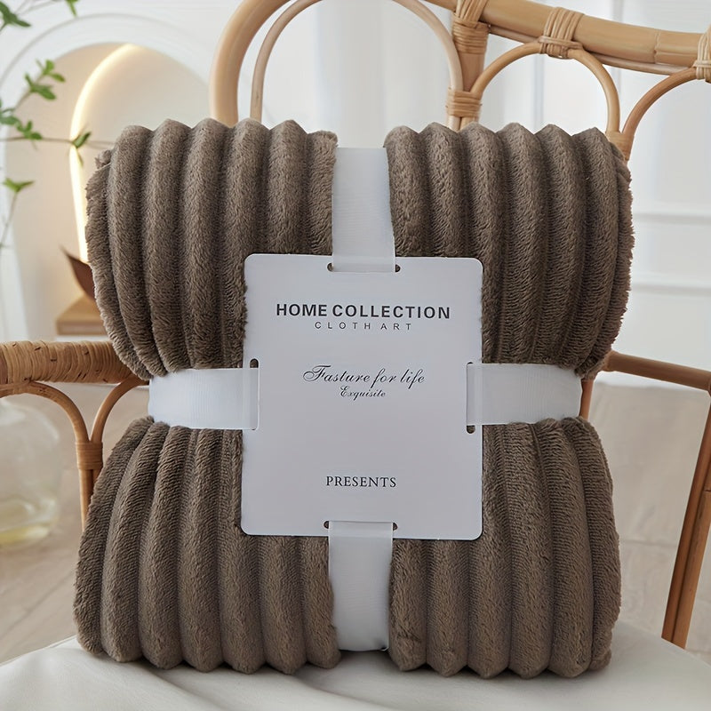 Brown textured blanket with a tag on a chair