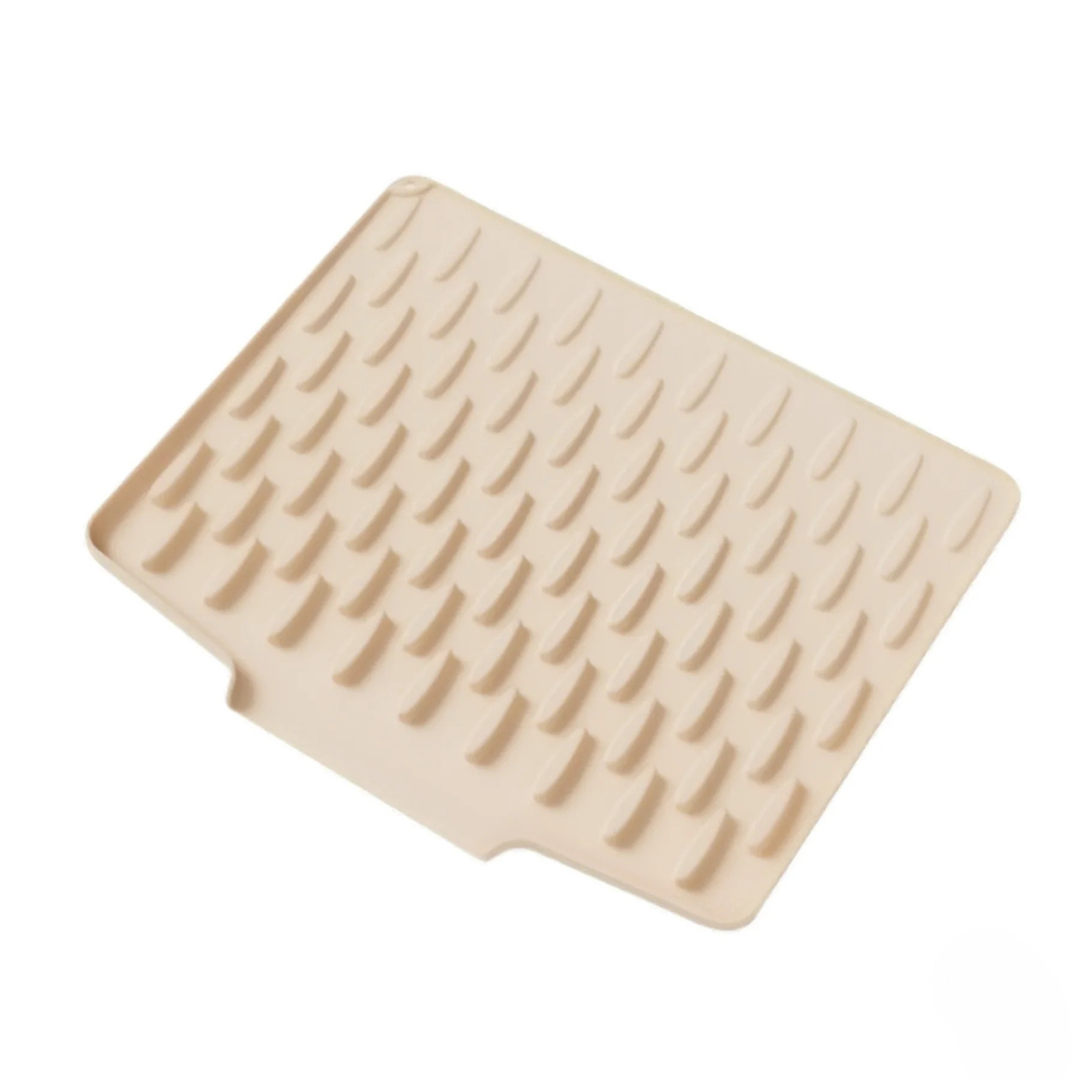 Beige rubber mat with textured surface on a white background