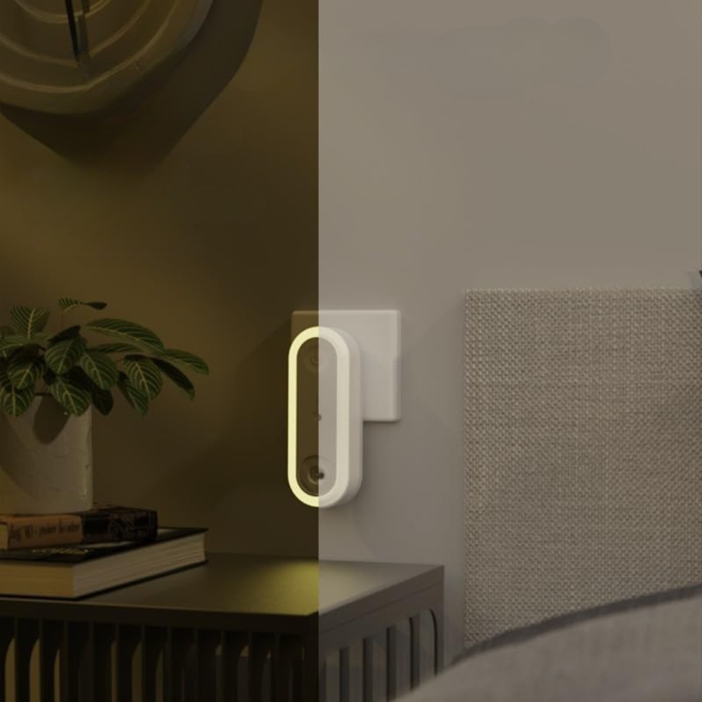 Modern night light on a wall next to a bed in a bedroom setting