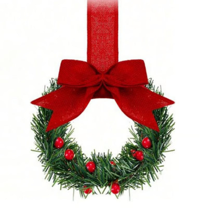 Christmas wreath with a red bow and berries on a white background