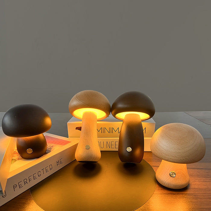 Four mushroom-shaped lamps on a wooden surface with a dark background