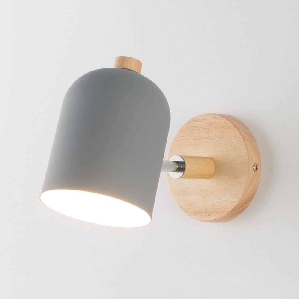 Wall-mounted light fixture with gray shade and wooden base on a white background