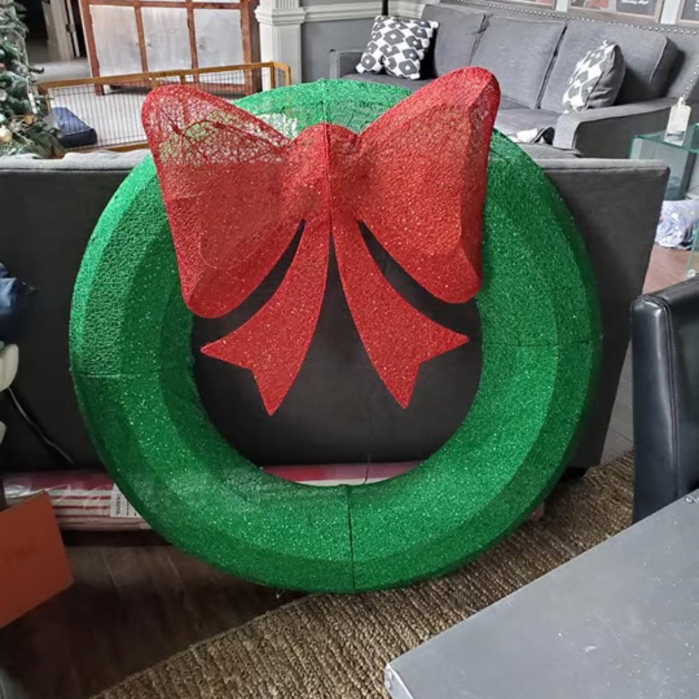 Decorative wreath with a red bow in a living room setting