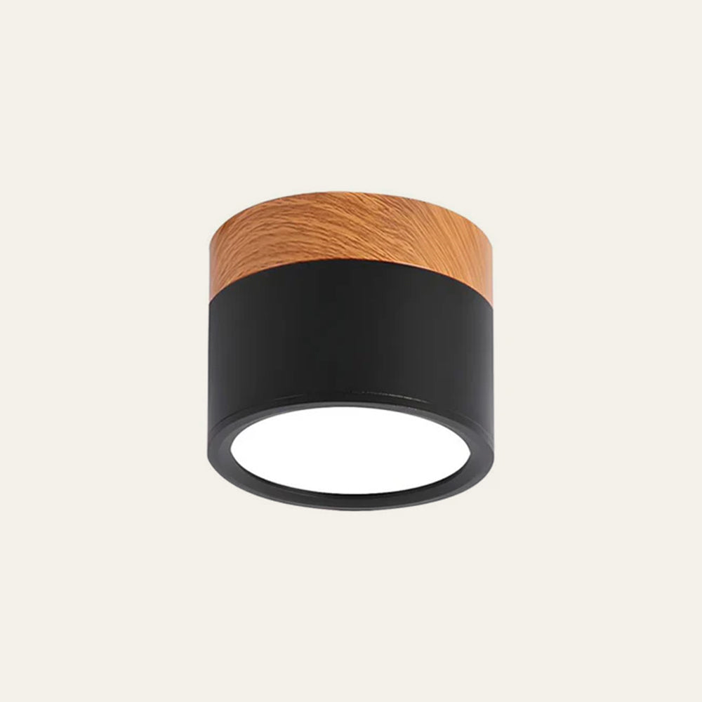 Ceiling light fixture with wooden top and black base on a beige background