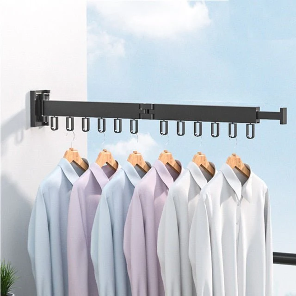 Clothing rack with shirts hanging on it against a light blue sky.