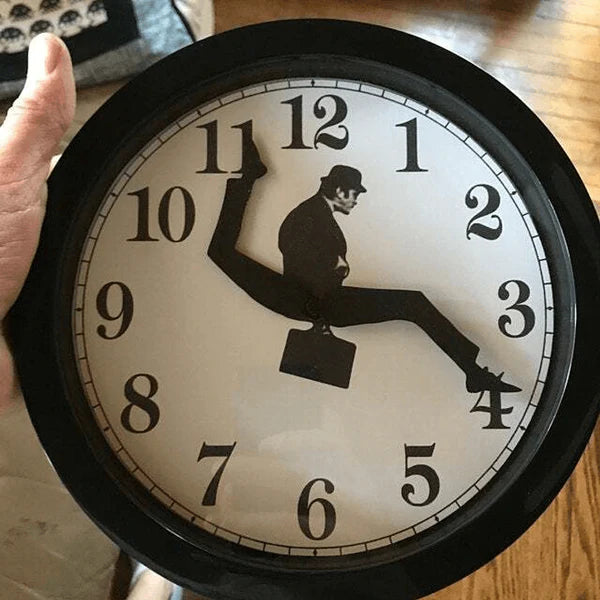 Wall clock with a design of a man running on the hour numbers
