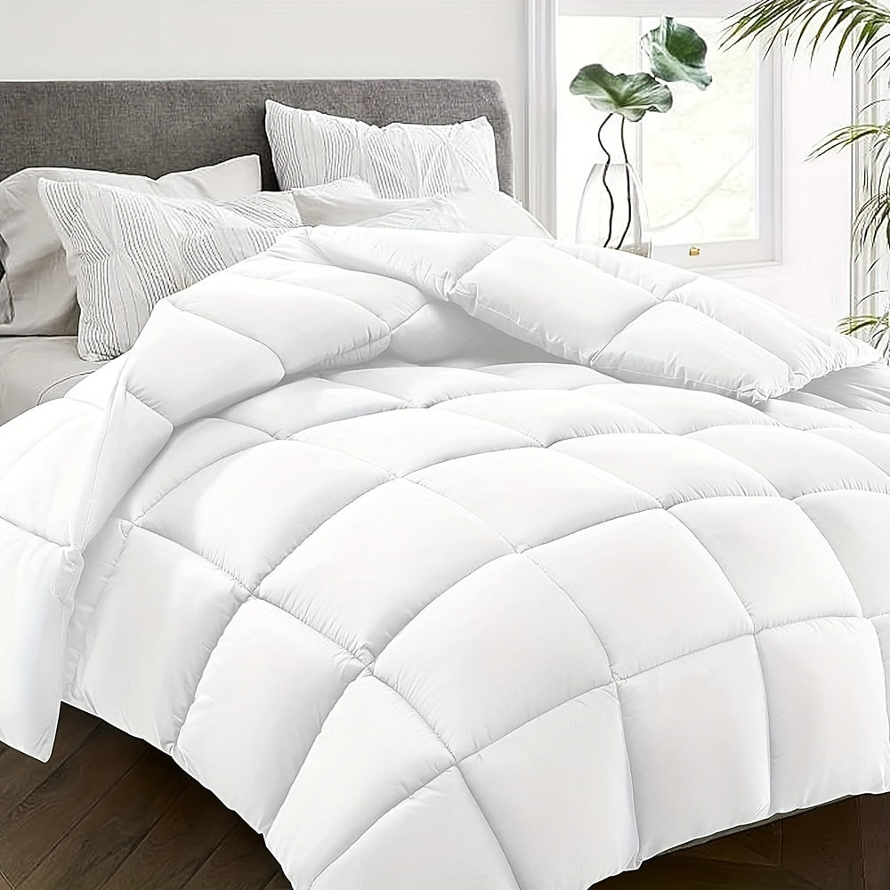 White comforter on a bed with pillows and a window in the background